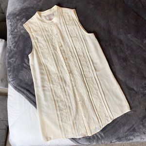 Cream sleeveless button up shirt
